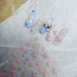 Detail of 3D embossed nail art stickers with traditional Chinese fans and roses