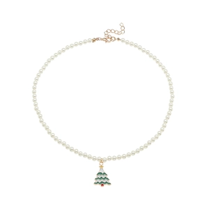 Detailed view of pearl necklace with green Christmas tree pendant and lobster clasp