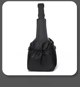 Side view detail of water-resistant black nylon crossbody bag showing elastic side pocket