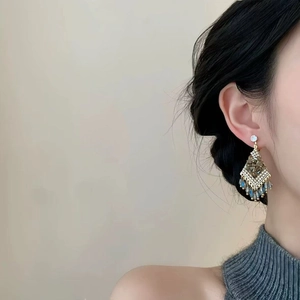 Exaggerated golden crystal tassel earrings with sparkling rhinestones for women