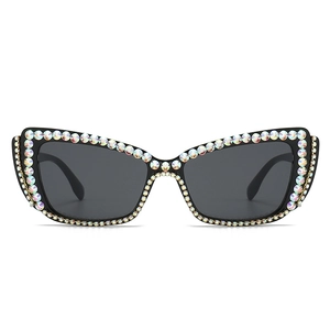 Cat eye sunglasses with black frame and rainbow AB rhinestones for street fashion style