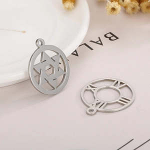 Macro detail of silver stainless steel Star of David and Roman numeral charms
