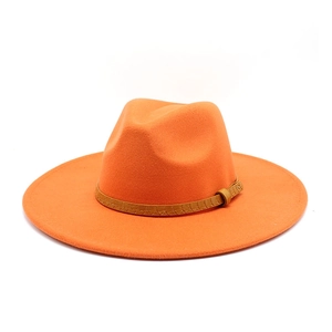 Close-up of orange fedora hat with brown crocodile texture leather band and metal buckle
