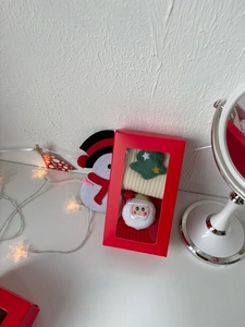 Christmas gift box with red packaging featuring Santa and tree pattern cotton socks