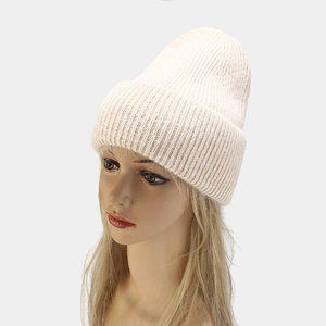 Detailed texture of thick ribbed knit beanie in off-white angora wool material