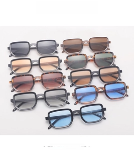 Collection of retro square sunglasses with colorful frames and lenses on light background
