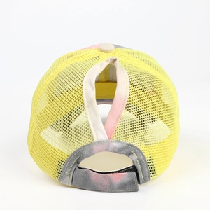 Detail view of tie-dye ponytail baseball cap with breathable yellow mesh and velcro strap