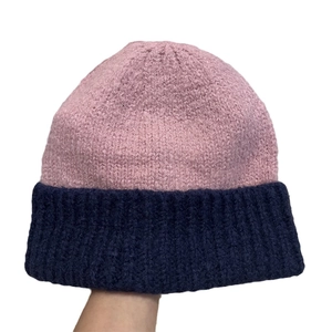 Two-tone pink and navy blue knit beanie for women in a warm minimalist winter style