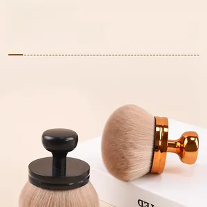 Macro detail of dense mushroom makeup brush bristles with gold and black handles