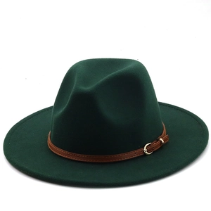 Detail of dark green wool felt fedora with a brown leather strap and gold metal buckle