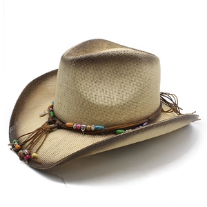 Detail of woven straw cowboy hat with colorful beads and leather cord decoration