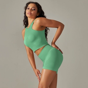 Detail of mint green seamless yoga set showing breathable texture and slim fit design