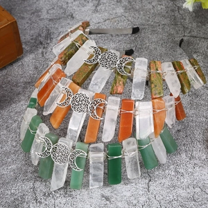 Detailed top view of natural crystal headbands with silver crescent moon ornaments