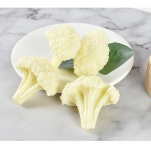 Detailed view of realistic PVC cauliflower models with texture on a white plate