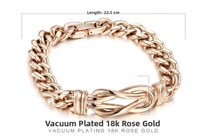 Detail of 18K rose gold-plated chunky link chain bracelet with a central knot design