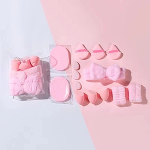 Pink makeup set with bow headband, wristbands, makeup sponges and powder puffs
