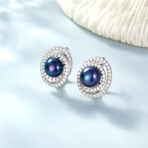 Detailed macro shot of vintage S925 silver earrings with dark purple pearls and zircon