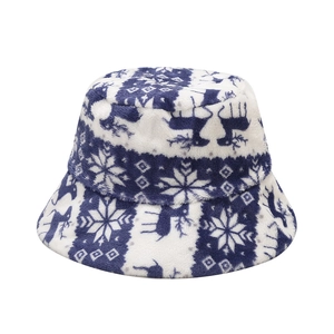 Winter plush bucket hat with reindeer and snowflake patterns in blue and white colors