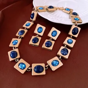 Retro luxury square necklace and earrings set with blue crystals in matte gold finish