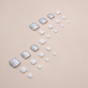 White and silver glitter wave pattern press-on toe nails in a natural square shape