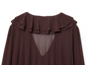 Detail view of the brown dress showing ruffle neckline and V-shaped mesh stitching back