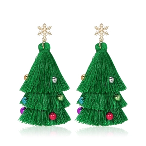 Green Christmas tree tassel earrings with golden snowflake charm on white background