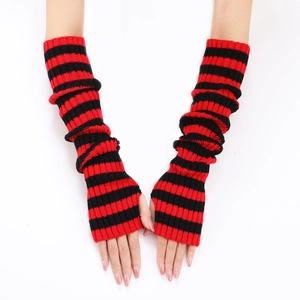 Detail of red and black striped knitted fingerless arm warmer gloves on model