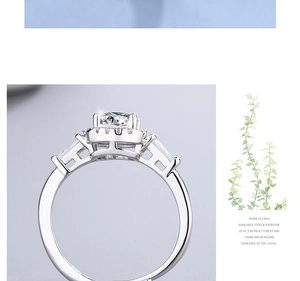 Detailed view of cushion cut cubic zirconia ring with baguette side stones and silver band