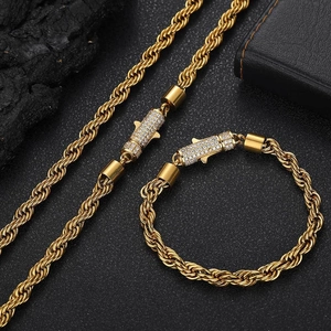 Detailed set of gold twist chain necklace and bracelet with crystal-inlaid lobster clasps