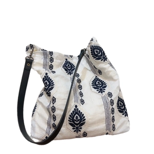 Minimalist cotton linen tote bag featuring vintage blue ethnic floral embroidery patterns