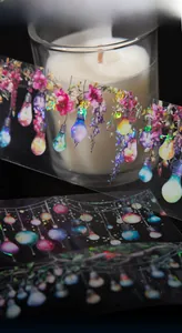 Detail of PET decorative tape with laser-processed floral and light string patterns