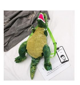 Detail of dinosaur plush backpack featuring green camo texture and yellow corduroy belly