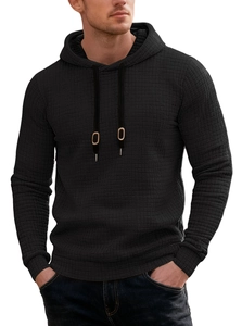 Detail of black waffle knit fabric and drawstring hood on casual men's long sleeve hoodie