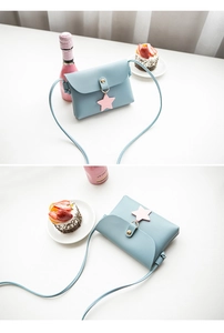 Light blue PU leather crossbody bag featuring a pink star pendant and gold metal snap