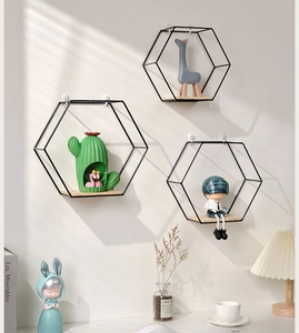 Modern wall-mounted black metal hexagonal floating shelf with a natural wooden base
