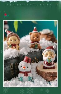 Miniature resin Christmas figurines featuring hedgehog and bear in cozy winter scene