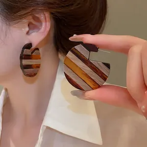 Retro C-shaped wooden hoop earrings with striped pattern and silver needles for women