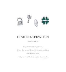 Macro detail of S925 sterling silver four-piece stud set with clover and key lock designs