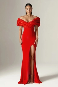 Detail of red off-shoulder evening dress with pleated bodice and sexy high leg slit