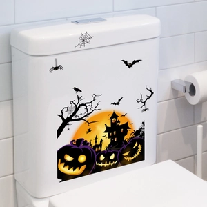 Close-up of Halloween toilet sticker featuring pumpkin, bats, and castle on white tank