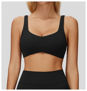 Close-up of black high-elastic yoga bra and leggings set with ergonomic U-neck design