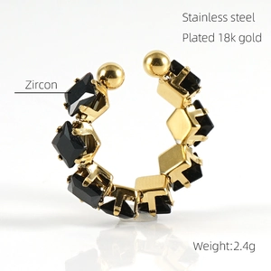 Macro shot of 18k gold plated stainless steel ring with black zircon stone details
