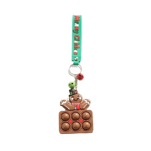 Brown gingerbread man pop fidget toy keychain with metal ring and Merry Christmas strap
