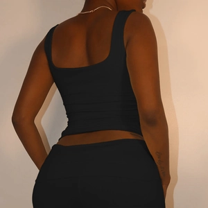 Rear view of a tight black backless vest featuring flattering slim fit ruching details