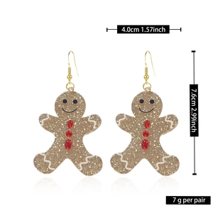 Detailed view of gingerbread man earrings with size measurements in centimeters and inches