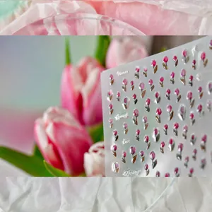 Macro detail of 3D embossed pink tulip nail stickers with delicate floral patterns