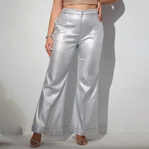 Close-up of metallic silver wide-leg trousers with high waist and hem details