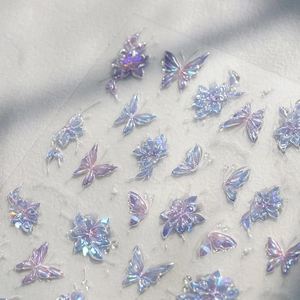 Holographic butterfly and flower nail art stickers with iridescent purple metallic finish