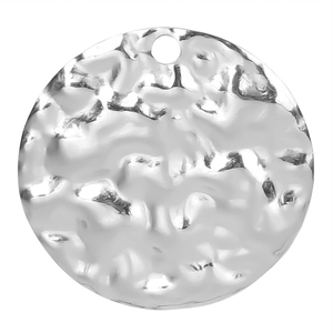 Close-up of a silver-toned hammered texture round metal pendant for DIY jewelry making