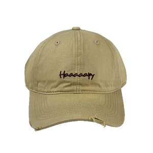 Distressed khaki baseball cap with Haaaaapy embroidery and a wide curved brim